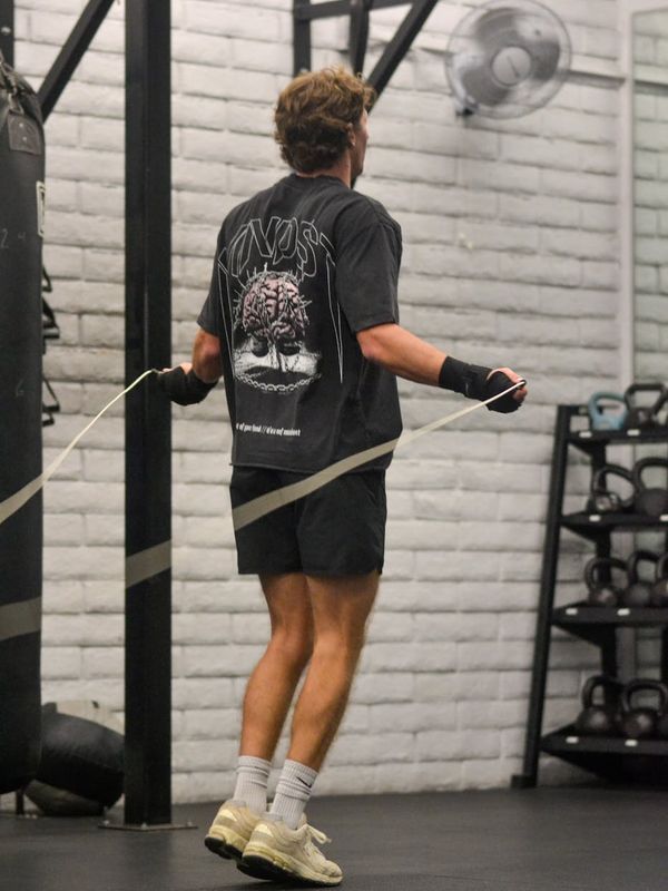 Person jumping with joy during a cardio workout session